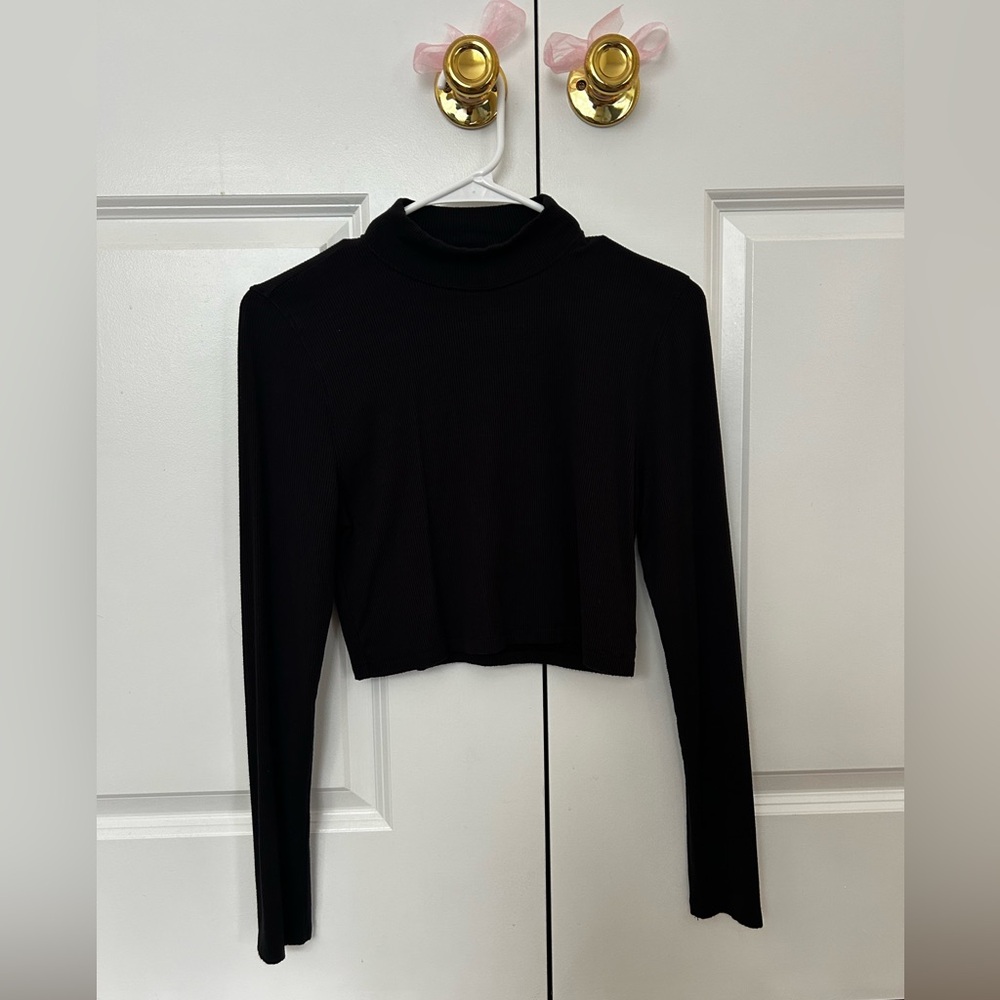 black, cropped, ribbed, turtleneck top. Size large but runs small.